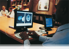 Close up image of a doctor using a computer tablet.